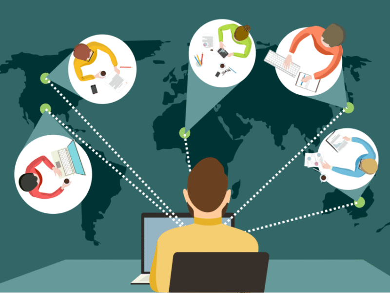 An illustration of a person working on a laptop, connecting virtually with four other people around the world, shown by dotted lines over a global map background. Each person is at a desk with various office supplies.